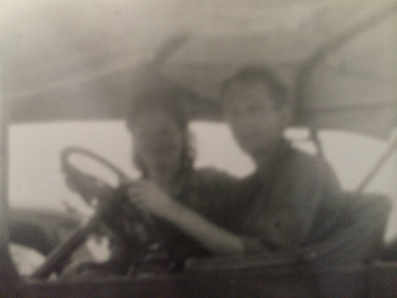 Two boys behind the wheel of a car