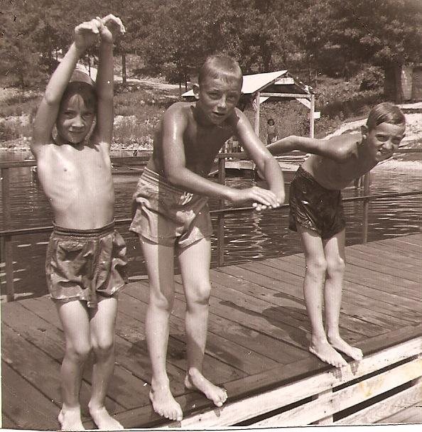 Three children on a dock at the Ozarks