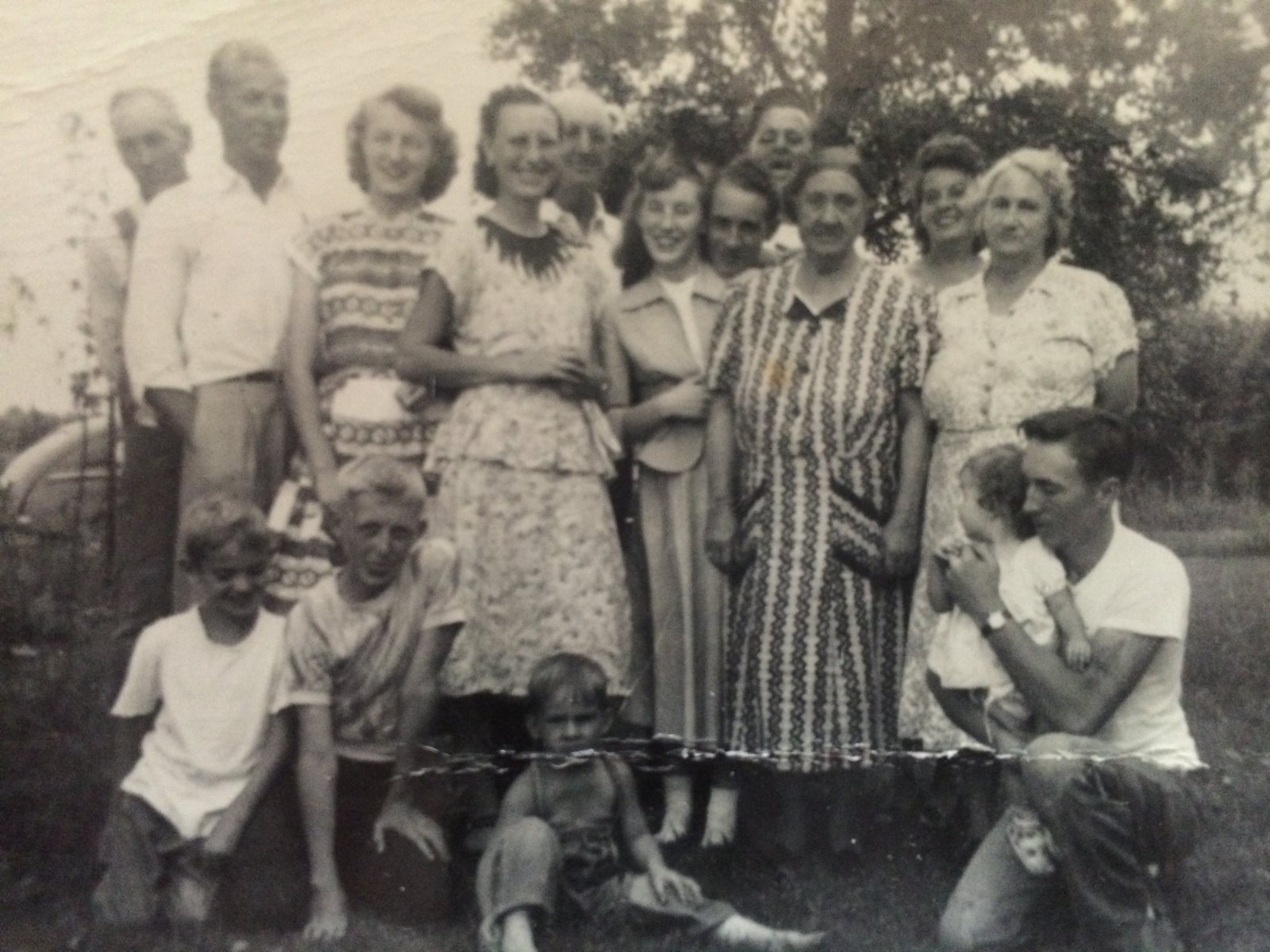A large family gathering on a lawn
